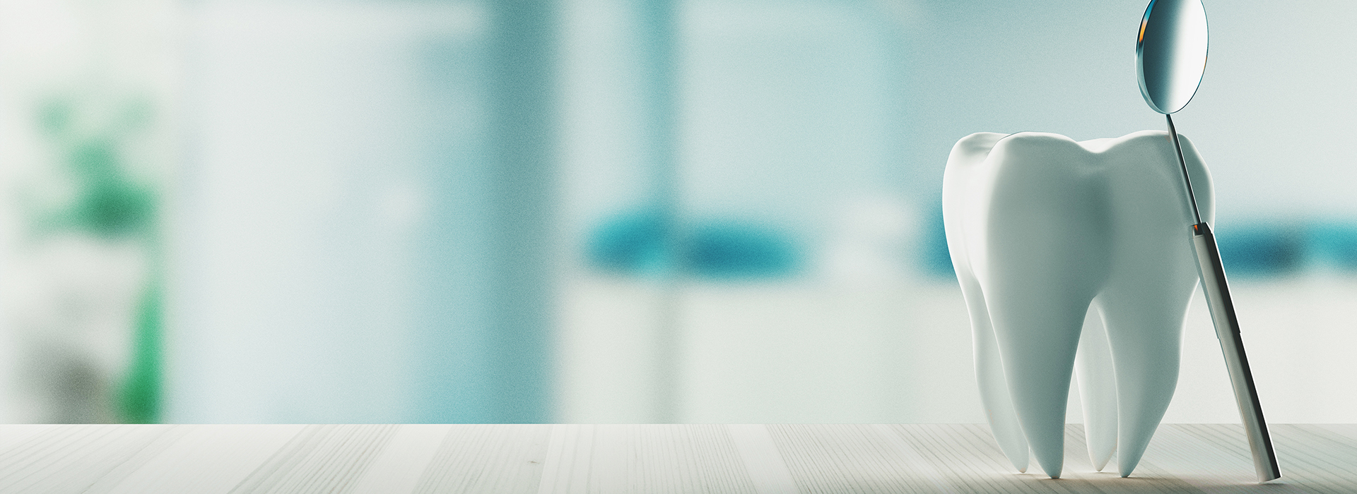 The image shows a white toothbrush with blue bristles sitting on a white countertop.